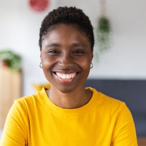 portrait-screen-view-of-smiling-millennial-african-woman-on-video-call-at-home.jpg