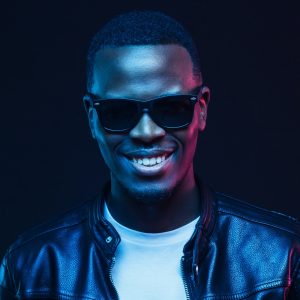 studio-portrait-of-smiling-african-american-male-model-wearing-trendy-sunglasses-and-leather-jacket.jpg